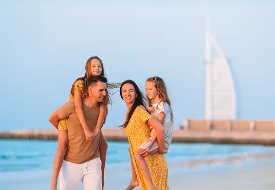 Happy family enjoying Dubai beach, highlighting family-friendly services at
Quickplus Amer Center.