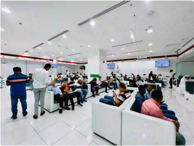 Active scene inside Amer Center, Dubai, with diverse clients and efficient service.