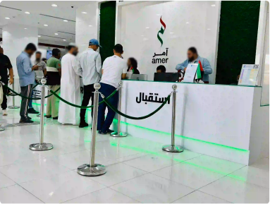 Customers engaging at Amer Center reception desk, exemplifying efficient customer service.